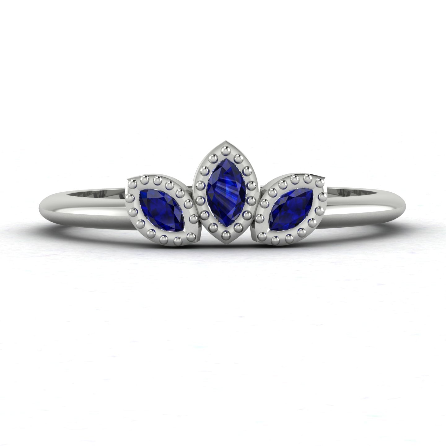 Front view of the Astraea Echo trilogy ring featuring a blue sapphire centre and blue sapphire marquise shoulders in white gold or platinum.