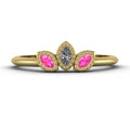 Front view of the Astraea Echo trilogy ring in 18ct yellow gold featuring a central diamond and two pink sapphire shoulders.
