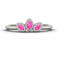 Front view of the Astraea Echo trilogy ring featuring a vibrant pink sapphire and two brilliant-cut diamond shoulders.