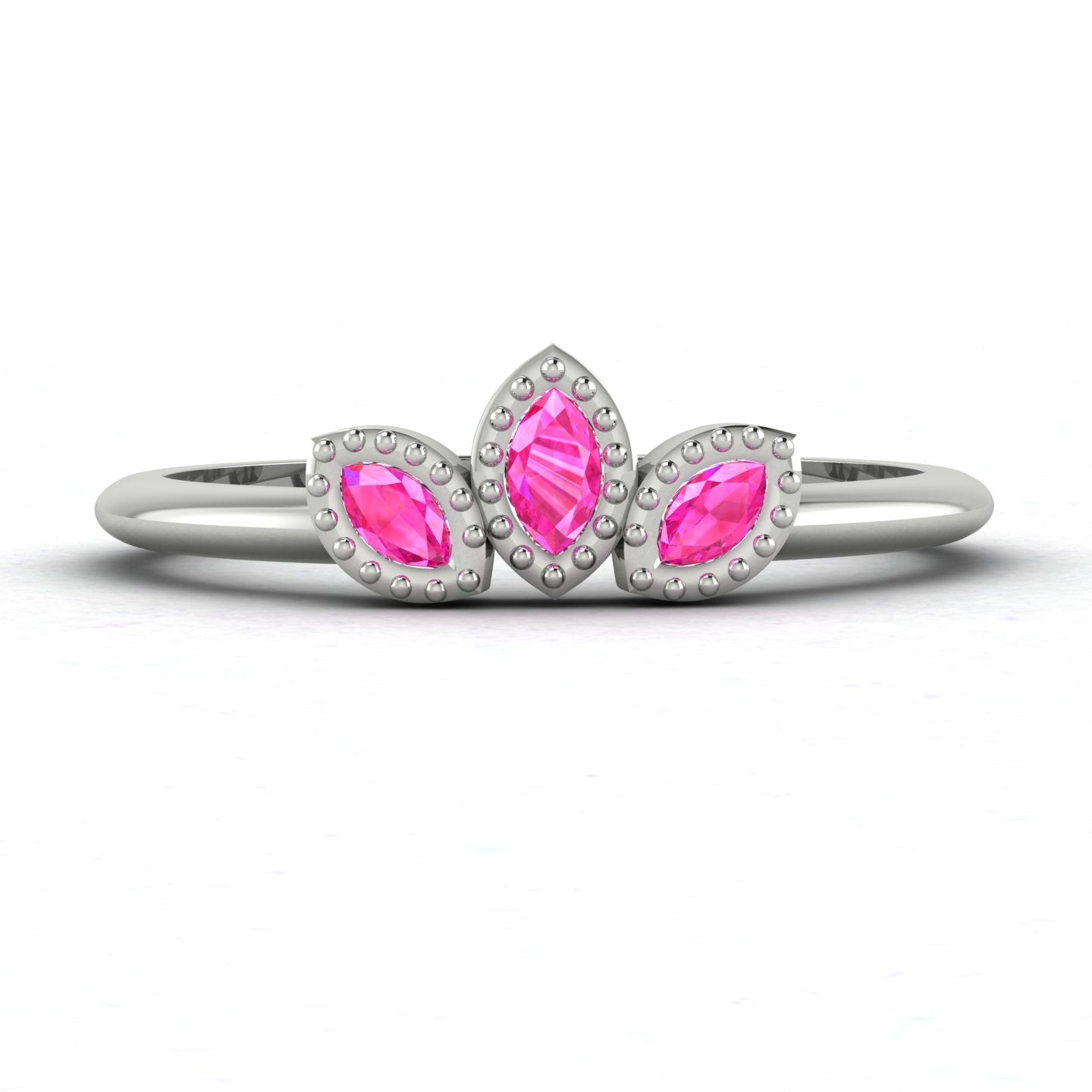 Front view of the Astraea Echo trilogy ring featuring a vibrant pink sapphire and two brilliant-cut diamond shoulders.