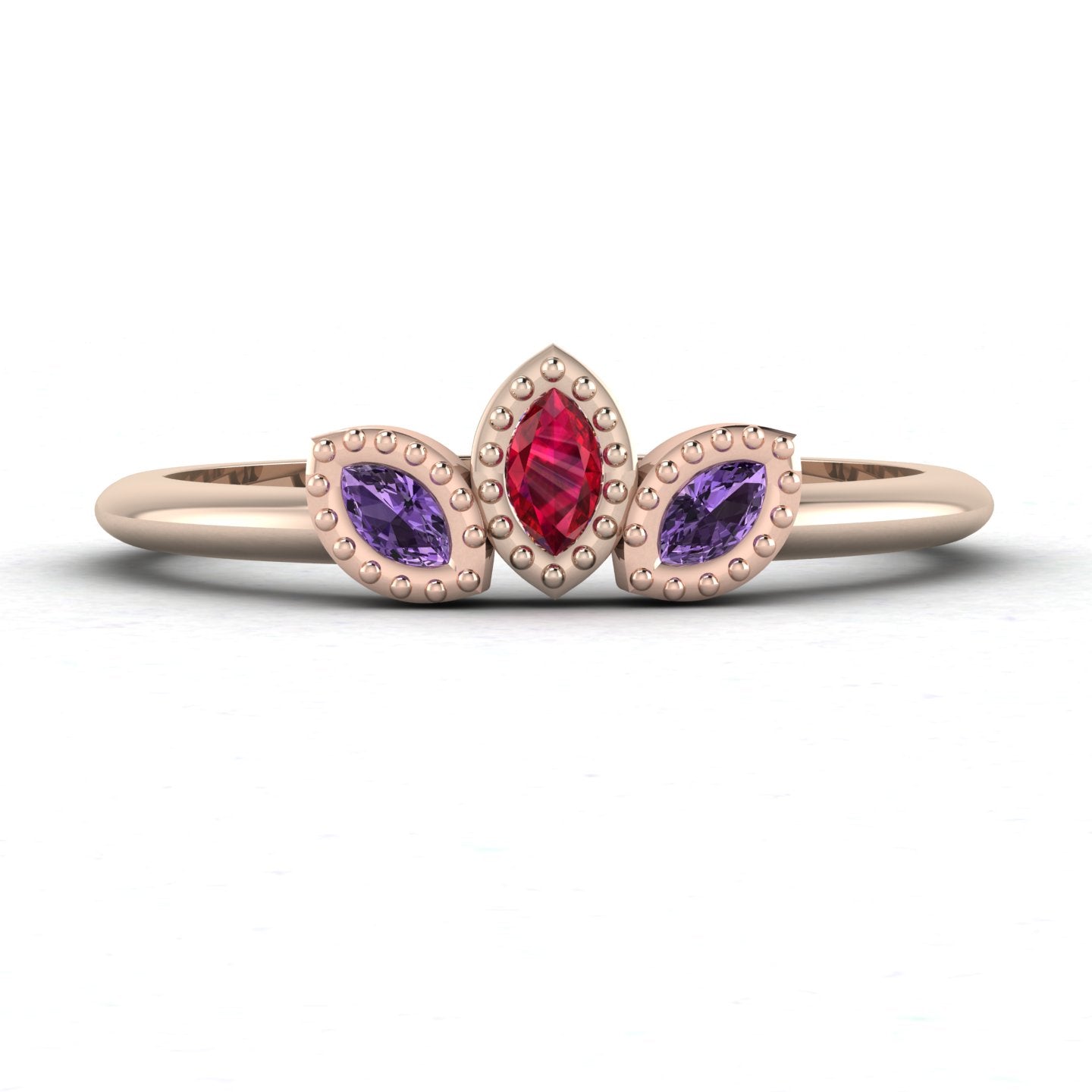 Front view of the Astraea Echo trilogy ring featuring a violet sapphire centre and ruby marquise shoulders in 18ct rose gold.