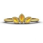 Front view of the Astraea Echo trilogy ring featuring a yellow sapphire centre and yellow sapphire marquise fan pattern in 18ct yellow gold.
