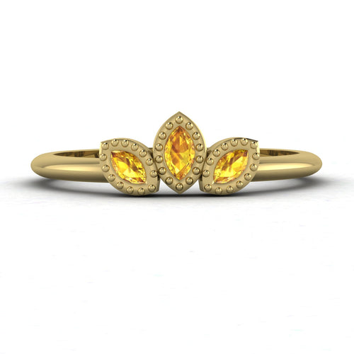 Front view of the Astraea Echo trilogy ring featuring a yellow sapphire centre and yellow sapphire marquise fan pattern in 18ct yellow gold.