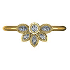 Top view of Astraea Liberty 18ct yellow gold ring featuring a central round diamond and a cluster of five marquise diamonds.