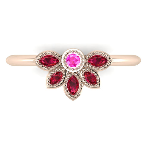 Top view of Astraea Liberty ring with a central ruby and a cluster of pink sapphire and ruby marquise stones in 18ct rose gold.