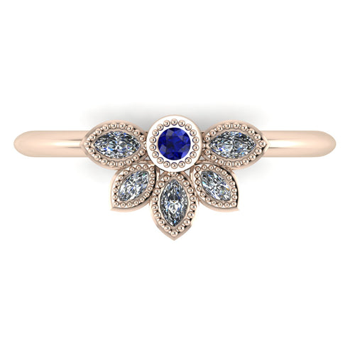 Top view of Astraea Liberty 18ct rose gold ring featuring a central blue sapphire and five marquise diamonds in a playful cluster.