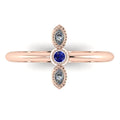 Top view of Astraea Trilogy 18ct rose gold ring featuring a central diamond and two round blue sapphires.