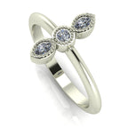Perspective view of the Astraea ring highlighting the depth of the diamond settings and the polished finish of the white gold band.