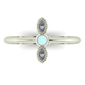 Top down view of an Astraea Trilogy ring with a central round diamond flanked by two horizontal marquise aquamarines in 18ct white gold.