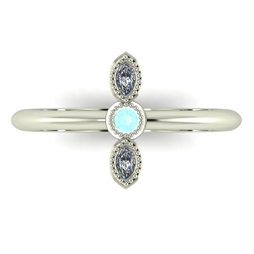 Top down view of an Astraea Trilogy ring with a central round diamond flanked by two horizontal marquise aquamarines in 18ct white gold.