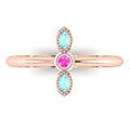 Top view of Astraea Trilogy 18ct rose gold ring with a central pink sapphire and two marquise-cut aquamarines.