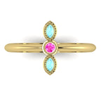Top view of Astraea Trilogy 18ct yellow gold ring with a central pink sapphire and two marquise-cut aquamarines.