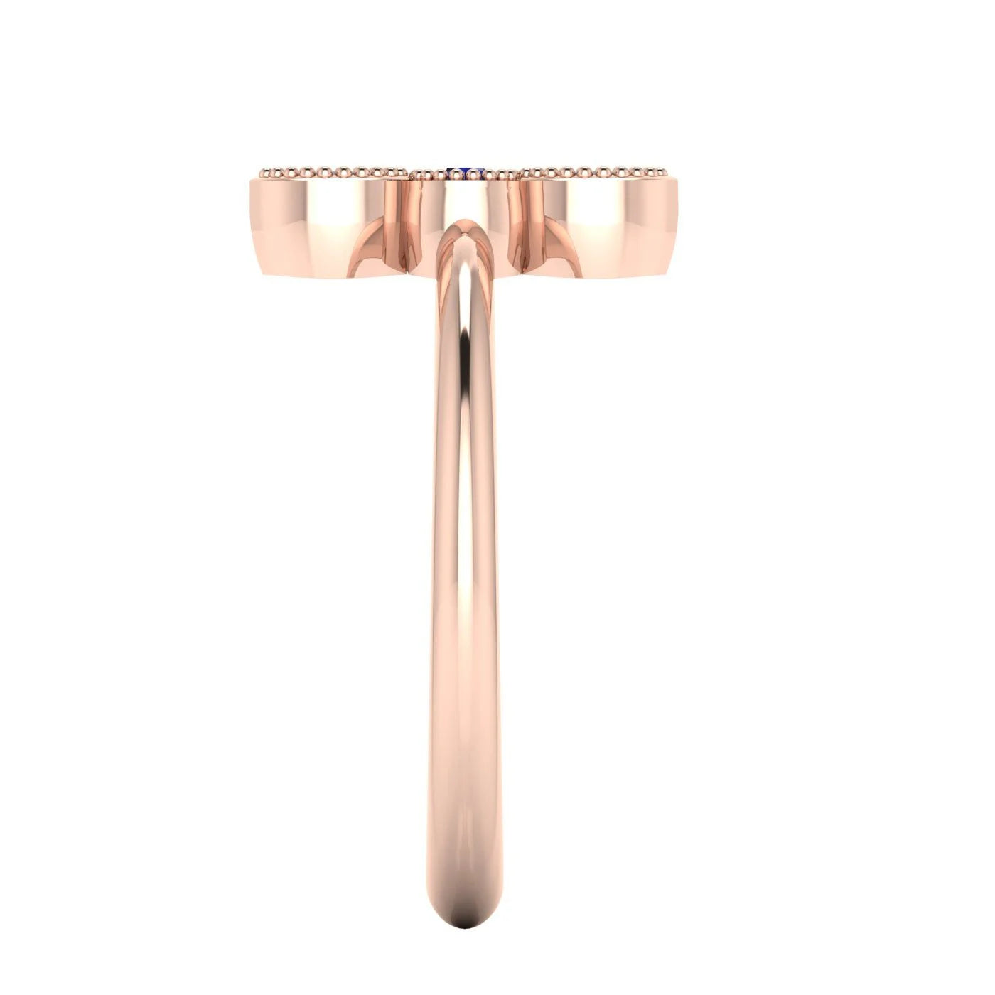Side profile of the Astraea Trilogy ruby and sapphire ring showing the secure setting and polished 18ct rose gold band.