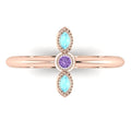 Top view of Astraea Trilogy 18ct rose gold ring featuring a central violet sapphire and two marquise aquamarines.