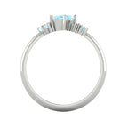 A view looking through the band, highlighting the intricate under-gallery construction and the secure mounting of the aquamarine and diamond stones.