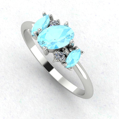 An angled perspective of the Atlantis ring, showcasing the organic, multi-stone layout and the delicate contrast between the aquamarines and diamonds.