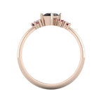 A view looking through the 18ct rose gold band, detailing the solid thickness of the ring and the intricate, architectural structure of the asymmetrical gemstone cluster.