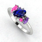 An angled perspective of the Atlantis ring, showcasing the organic arrangement of the blue rainbow sapphires against the polished white gold or platinum band.