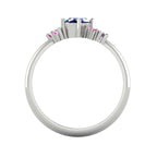 A view looking through the band, highlighting the intricate under-gallery and the secure mounting of the violet, pink, and blue sapphire stones.