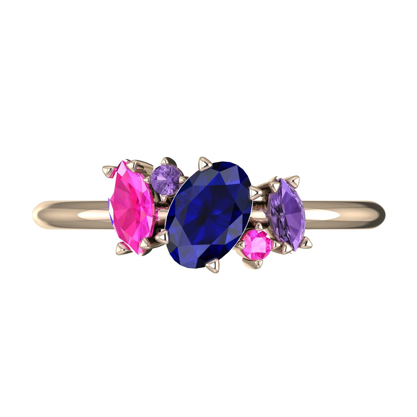 A top-down view of the Atlantis engagement ring, featuring an asymmetrical cluster of blue rainbow sapphires in various shades set in 18ct rose gold.