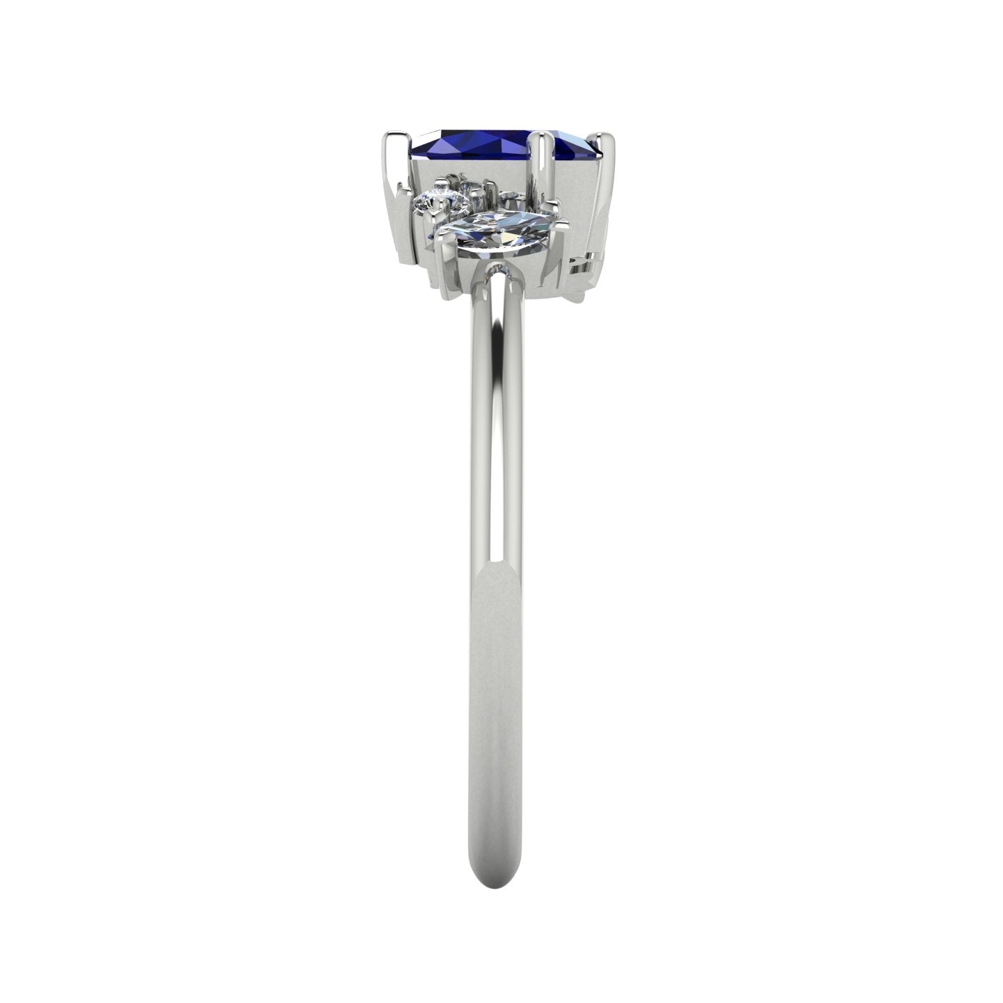 A side profile shot of the Atlantis asymmetrical ring, detailing the unique heights of the sapphire and diamond settings and the polished finish of the band.