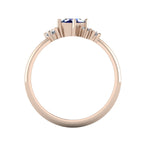 A view looking through the band, detailing the substantial thickness of the 18ct rose gold and the architectural, hand-carved arrangement of the gemstone cluster.