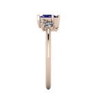 A side profile shot of the Atlantis asymmetrical ring, highlighting the unique heights of the hand-set blue sapphires and the contemporary, slim profile of the band.