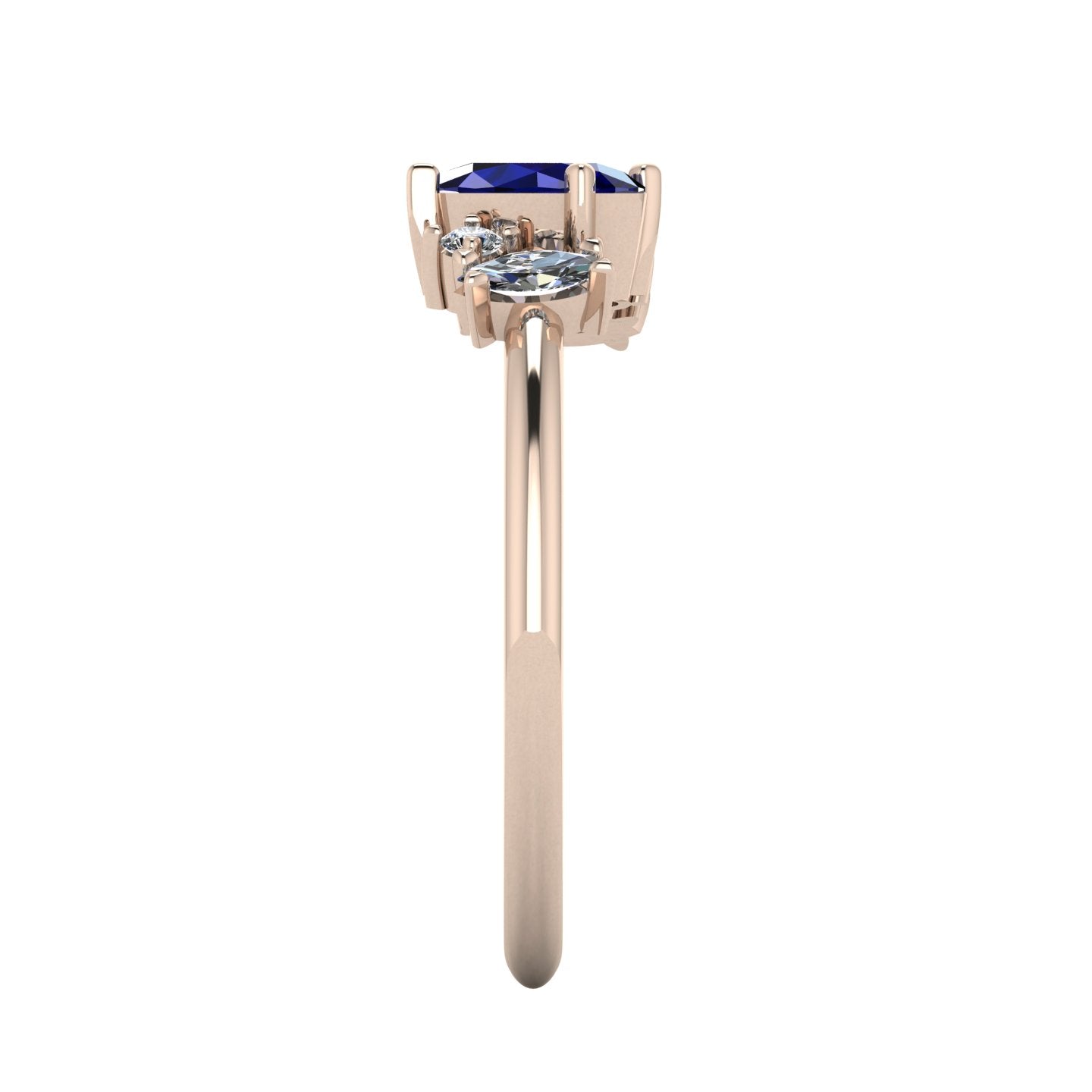 A side profile shot of the Atlantis asymmetrical ring, highlighting the unique heights of the hand-set blue sapphires and the contemporary, slim profile of the band.