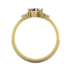A view looking through the 18ct yellow gold band, highlighting the intricate under-gallery and the secure mounting of the blue sapphire and diamond cluster.