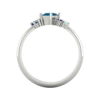 A view looking through the band, showcasing the intricate craftsmanship of the under-gallery and the light-reflecting qualities of the blue gemstones.