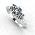 Atlantis diamond asymmetrical engagement ring in platinum or 18ct white gold, angled view showing the sculptural diamond cluster and asymmetric band, handmade in our London studio
