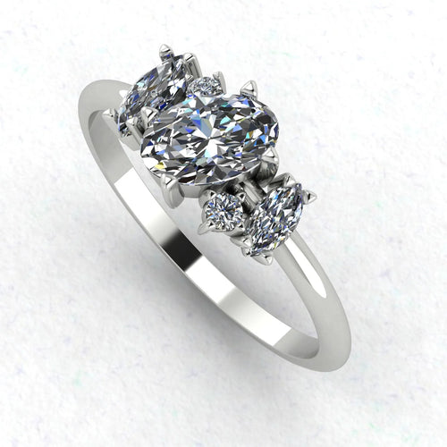 Atlantis diamond asymmetrical engagement ring in platinum or 18ct white gold, angled view showing the sculptural diamond cluster and asymmetric band, handmade in our London studio