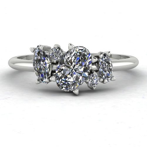 Atlantis diamond asymmetrical engagement ring in platinum or 18ct white gold, front view showing the organic diamond cluster and sculptural asymmetric setting, handmade in our London studio