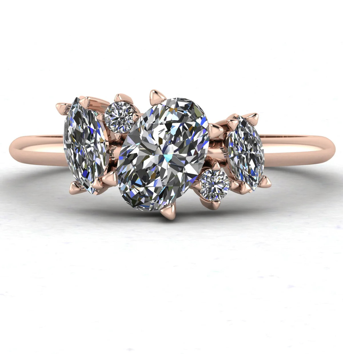 Atlantis asymmetrical diamond engagement ring in 18ct rose gold, front view showing oval and marquise diamond cluster