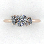 A top-down view of the Atlantis engagement ring, showcasing an asymmetrical cluster of sparkling diamonds set in 18ct rose gold.