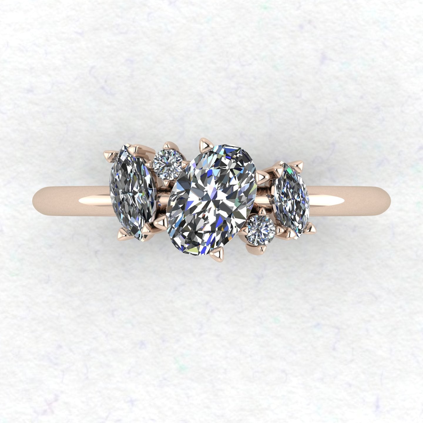 A top-down view of the Atlantis engagement ring, showcasing an asymmetrical cluster of sparkling diamonds set in 18ct rose gold.