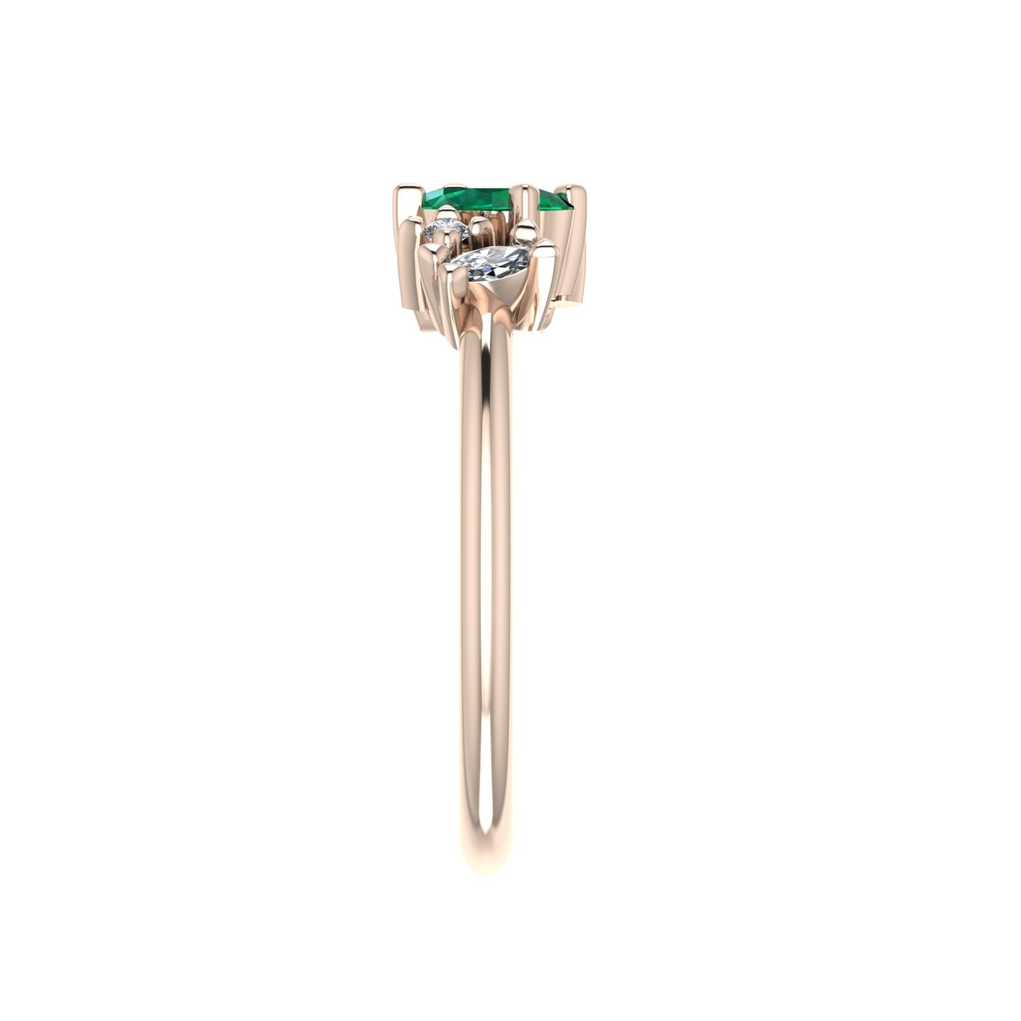 A side profile shot of the Atlantis asymmetrical ring, highlighting the unique, hand-set arrangement of the emeralds and the elegant, slim profile of the rose gold band.