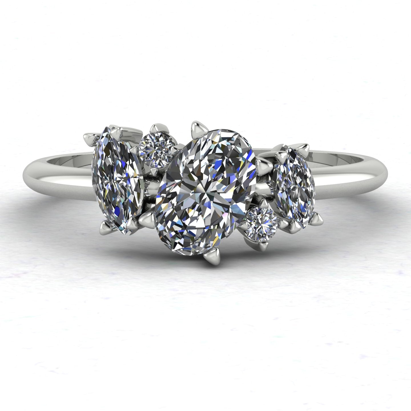 Front view of the Atlantis engagement ring, featuring a contemporary asymmetrical cluster of sparkling lab grown diamonds in a white metal setting.
