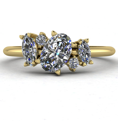 Front view of the Atlantis engagement ring, featuring a cluster of brilliant-cut diamonds in an asymmetrical 18ct yellow gold setting.