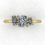 Top view of the Atlantis engagement ring, featuring a contemporary asymmetrical cluster of sparkling lab grown diamonds in an 18ct yellow gold setting.