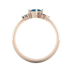 Atlantis London blue topaz and sapphire asymmetrical engagement ring in 18ct rose gold, through-finger view showing the hallmark and detailed asymmetric stone mountings, handmade in our London studio