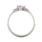 A view looking through the band, highlighting the intricate under-gallery and the secure mounting of the pink sapphire and diamond stones.