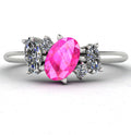 Front view of the Atlantis engagement ring, featuring an asymmetrical cluster of vivid pink sapphires and brilliant diamonds set in white gold or platinum.