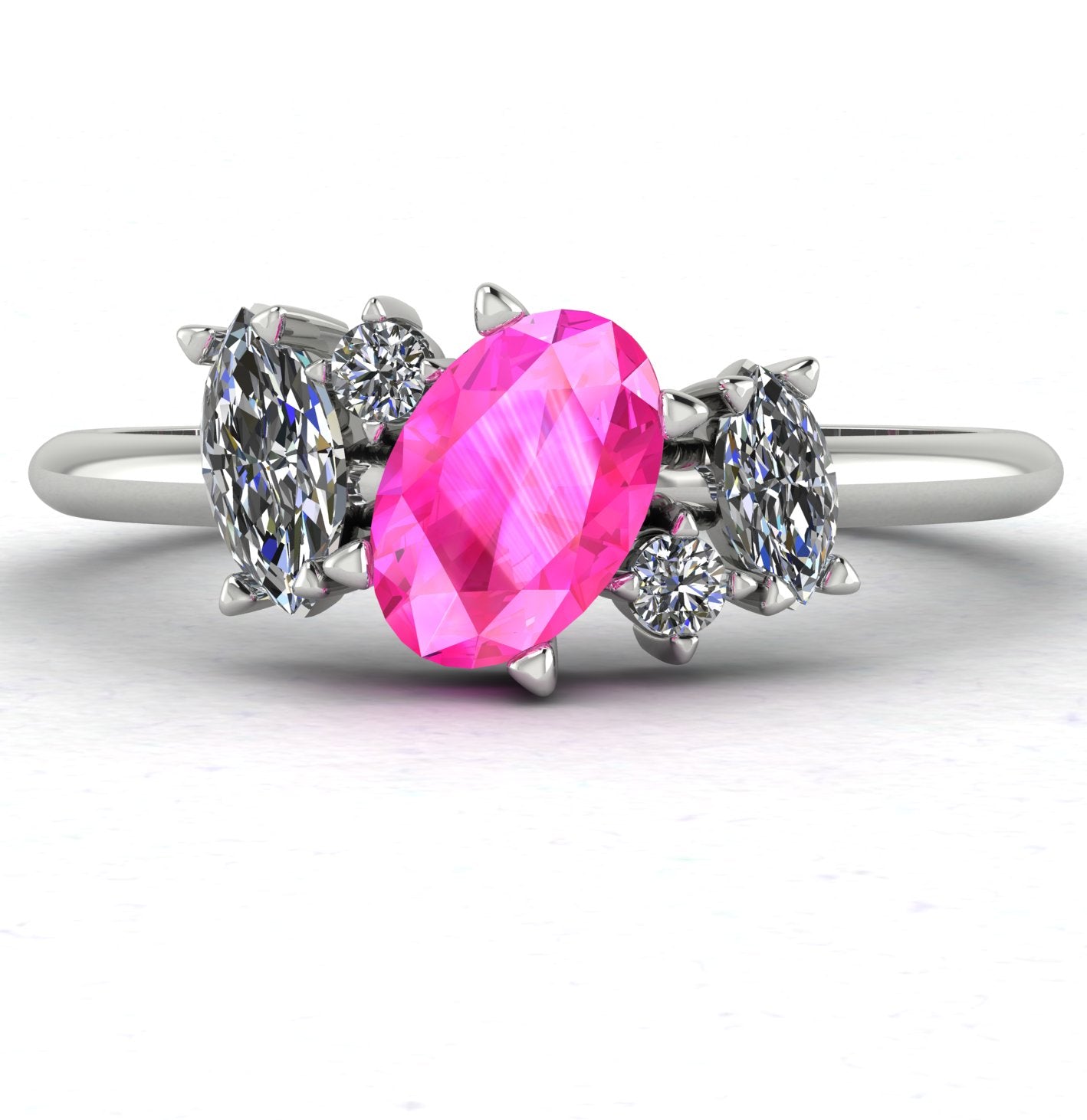 Front view of the Atlantis engagement ring, featuring an asymmetrical cluster of vivid pink sapphires and brilliant diamonds set in white gold or platinum.
