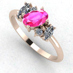 An angled perspective of the Atlantis ring, highlighting the organic, flowing lines of the rose gold band and the multifaceted sparkle of the pink sapphire cluster.