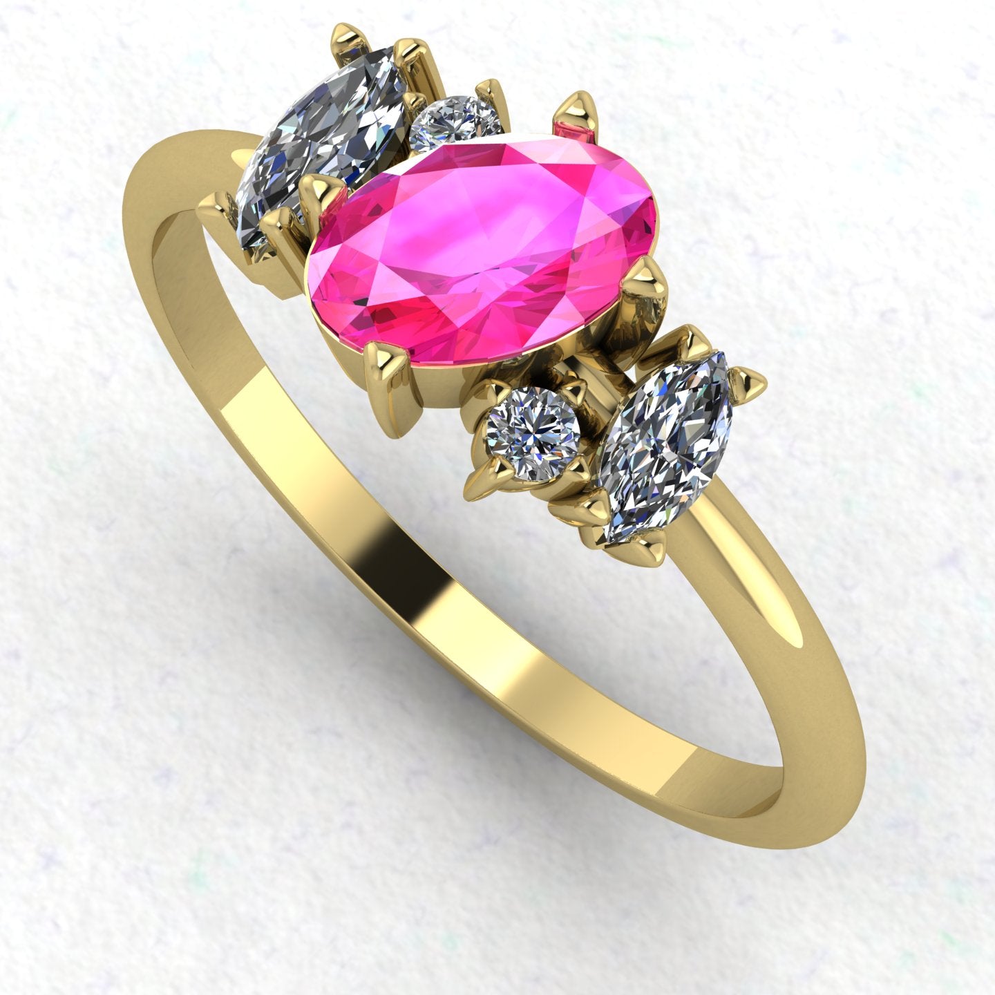An angled perspective of the Atlantis ring, showcasing the organic, contemporary design and the rich contrast of pink sapphires against the yellow gold band.