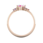 A view looking through the 18ct rose gold band, showing the intricate under-gallery and the internal craftsmanship of the asymmetrical mount.