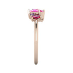 A side profile of the Atlantis asymmetrical ring, detailing the unique organic settings and the way the ruby and sapphires are nestled in the rose gold.