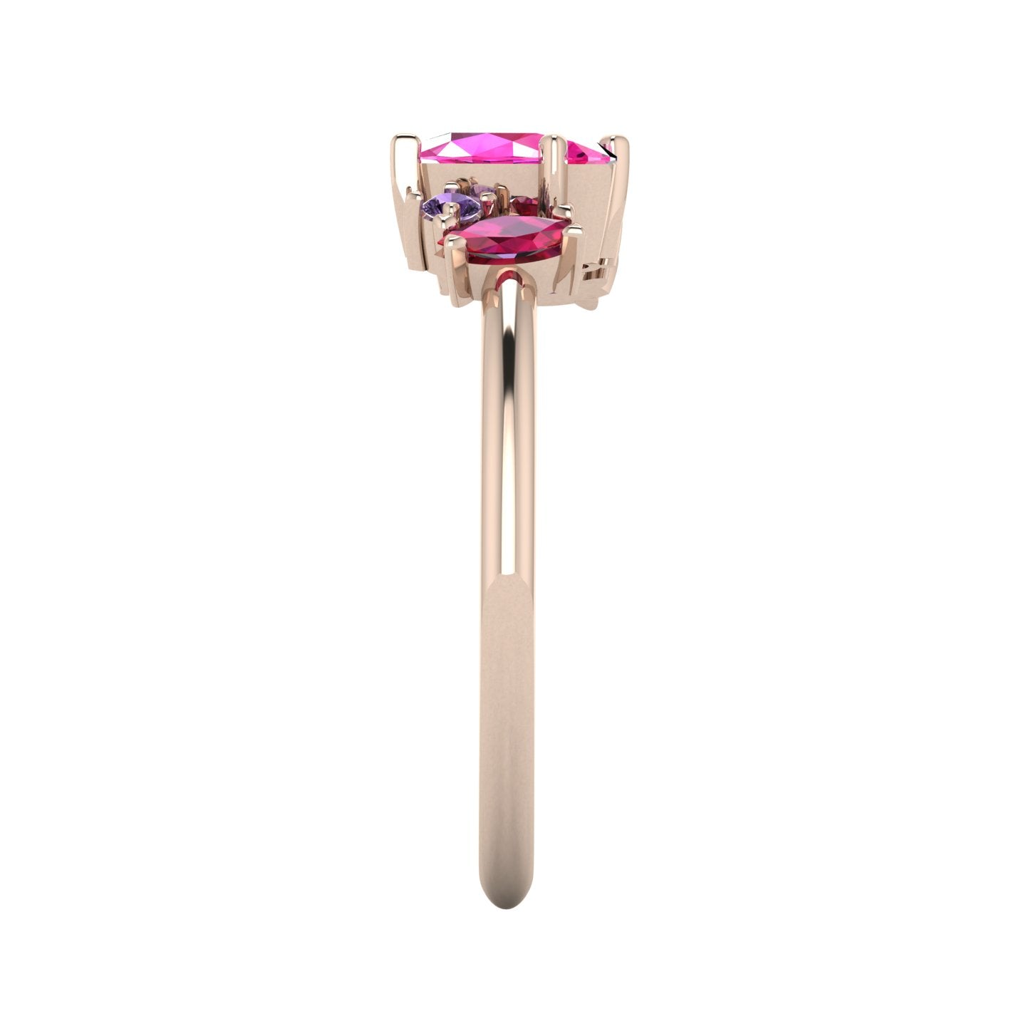 A side profile of the Atlantis asymmetrical ring, detailing the unique organic settings and the way the ruby and sapphires are nestled in the rose gold.