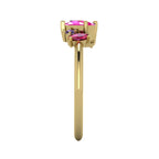 A side profile shot of the Atlantis ring detailing the unique organic settings and the varying heights of the pink, violet, and red gemstones.